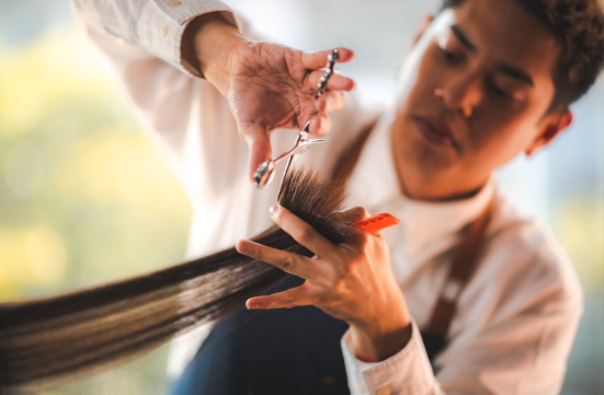 hairstylist cutting hair
